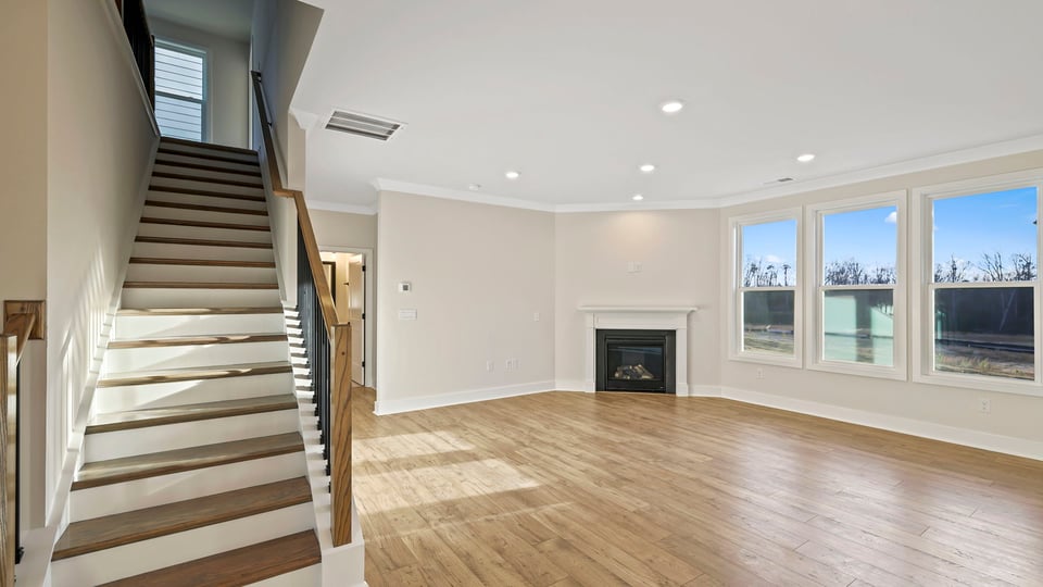 Living room with window and fireplace.