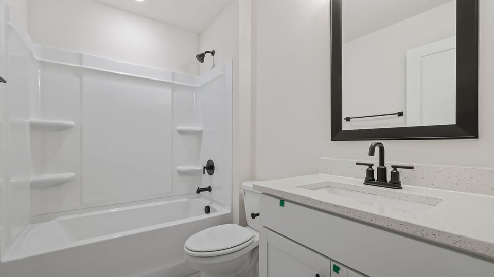 Bathroom with vanity sinks.