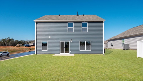 Back exterior of Penwell with large backyard.