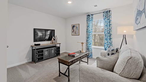 Bedroom with carpet and window.