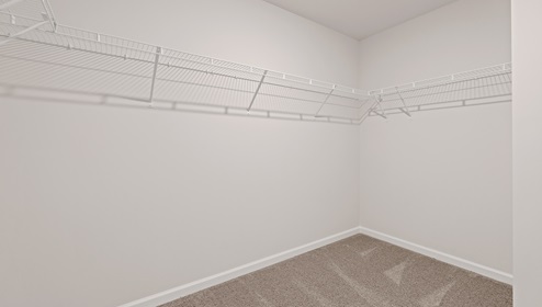 Closet with hanging storage racks.