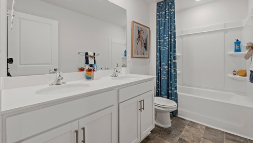 Bathroom with double vanity sink.