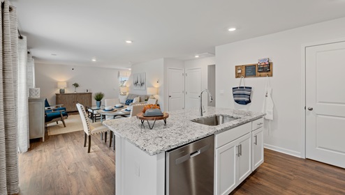 Kitchen and island with granite counter tops.