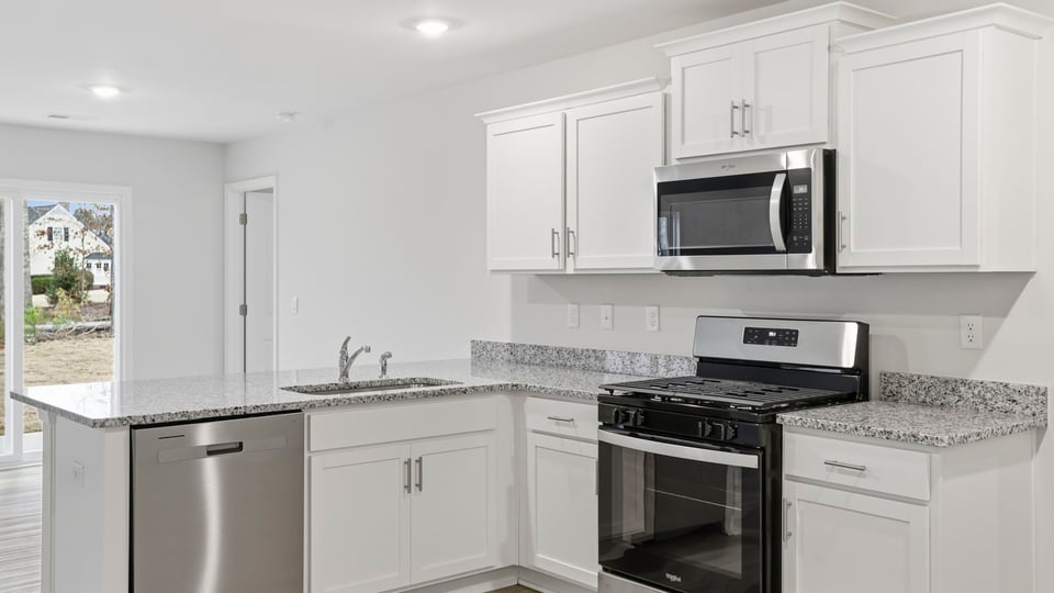 View of kitchen and door to the back yard.