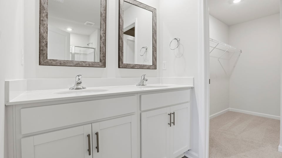 Primary bathroom with dual sink vanity.