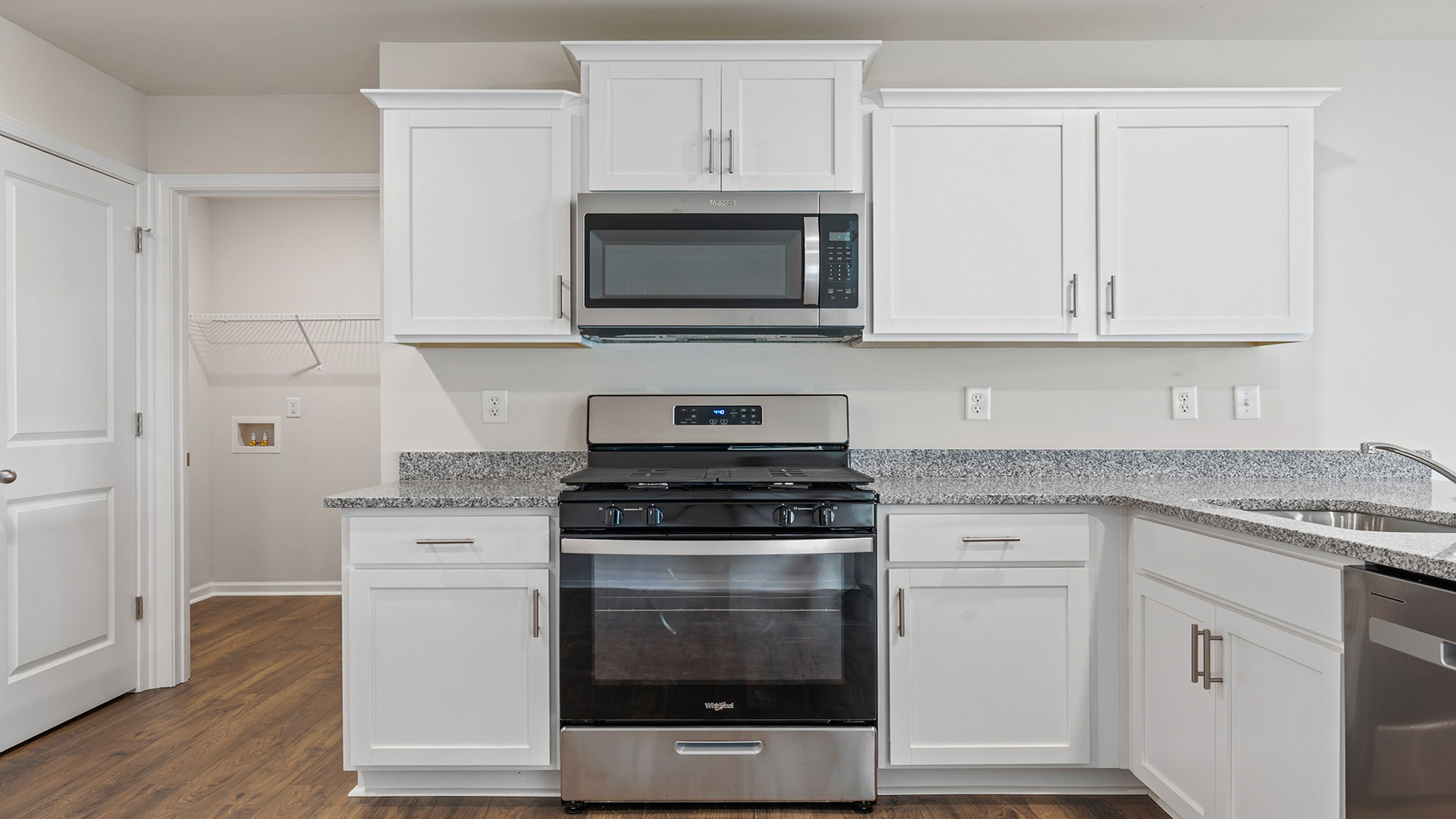 Kitchen with cabinets and window.