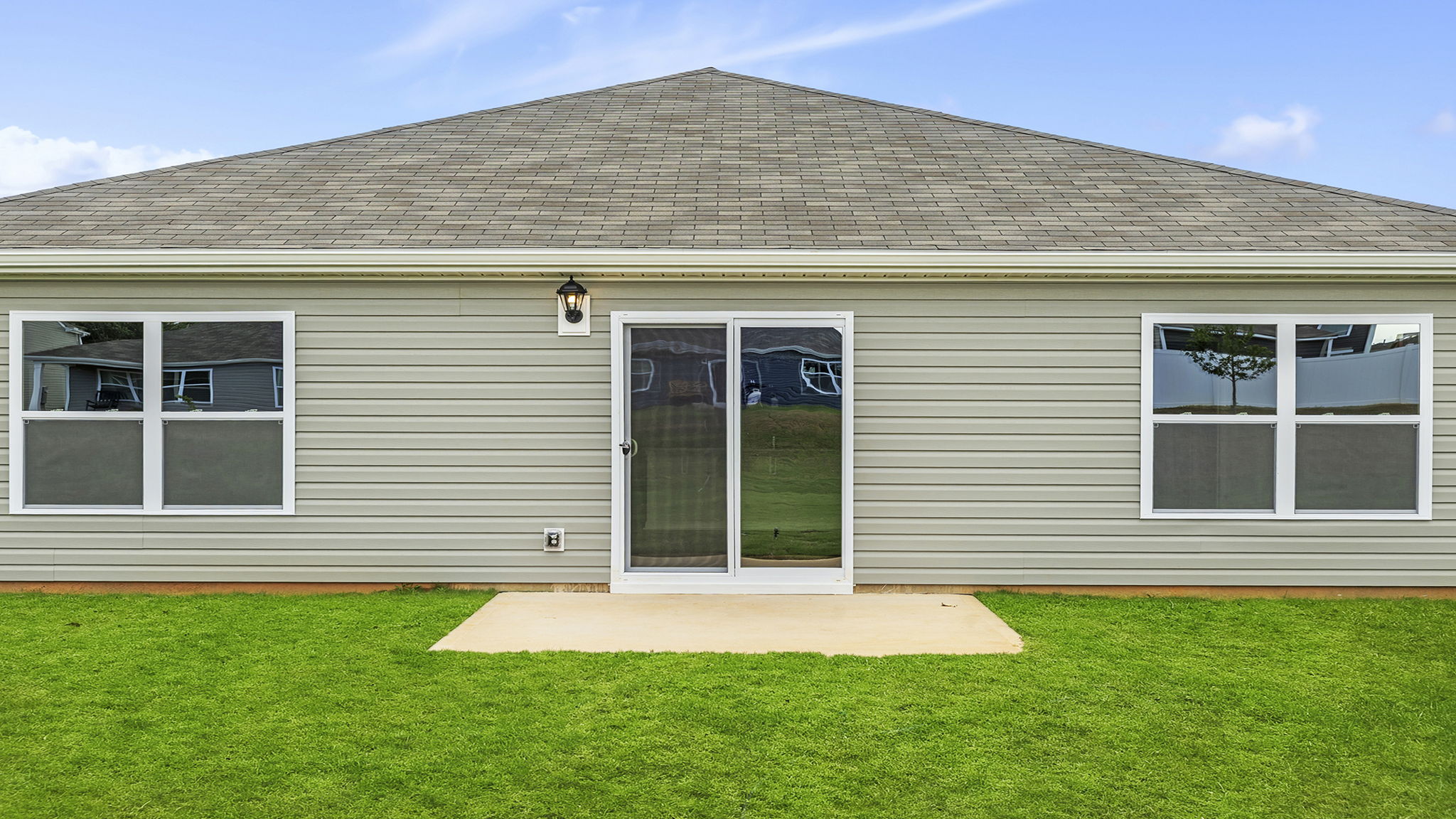 Back exterior with patio.