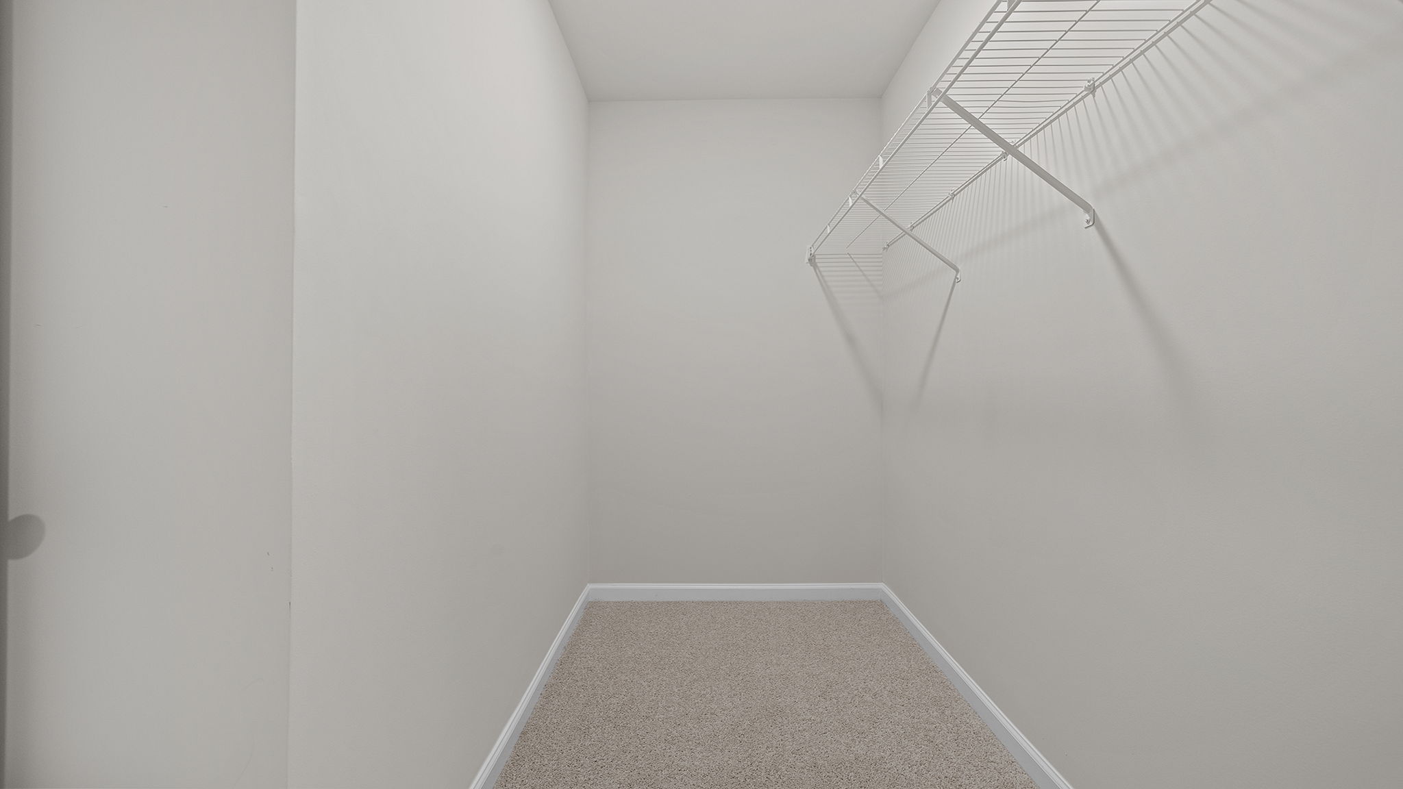 Primary bedroom walk-in closet.