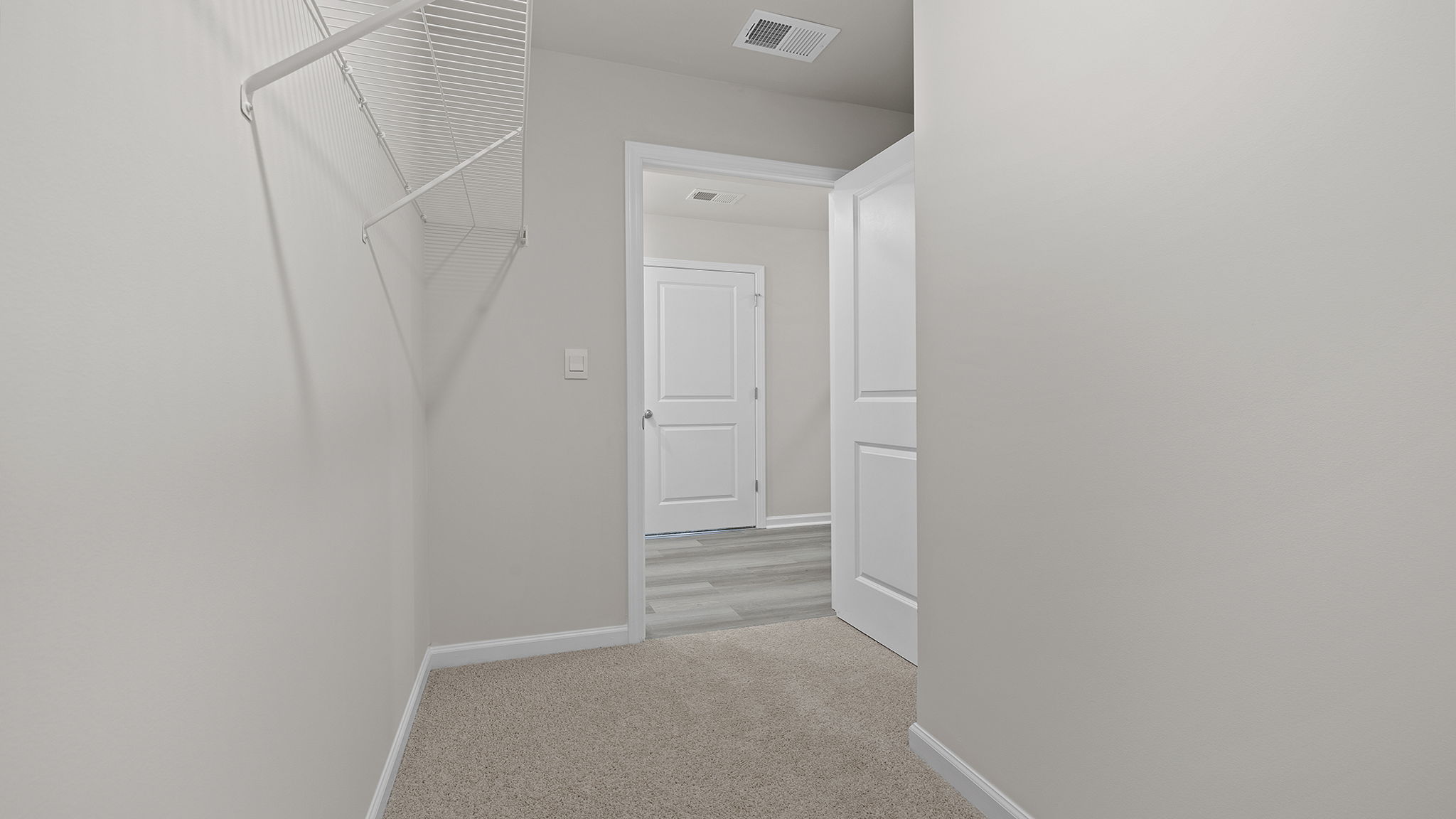 Primary bedroom walk-in closet.