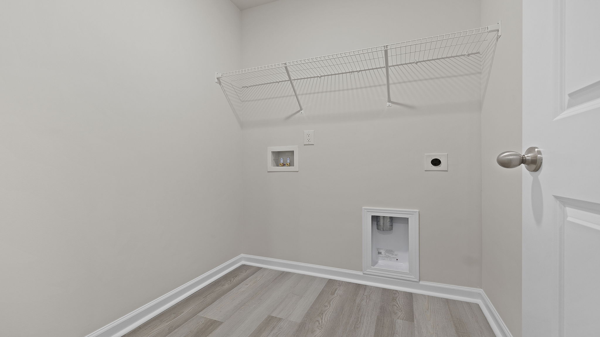 Laundry room with shelving.