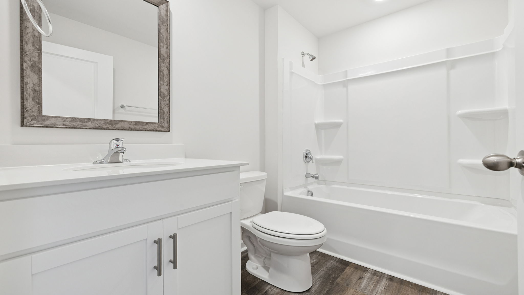 Hall bathroom with vanity and shower / tub.