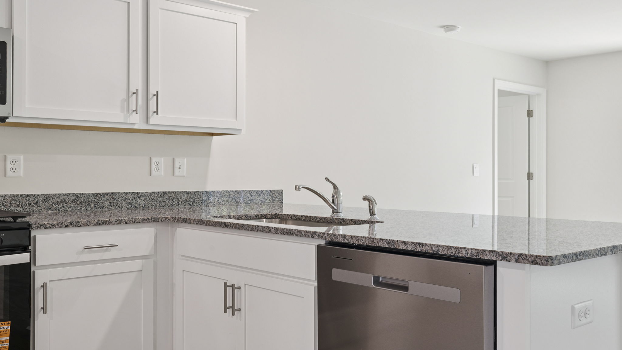 Kitchen with granite countertops.