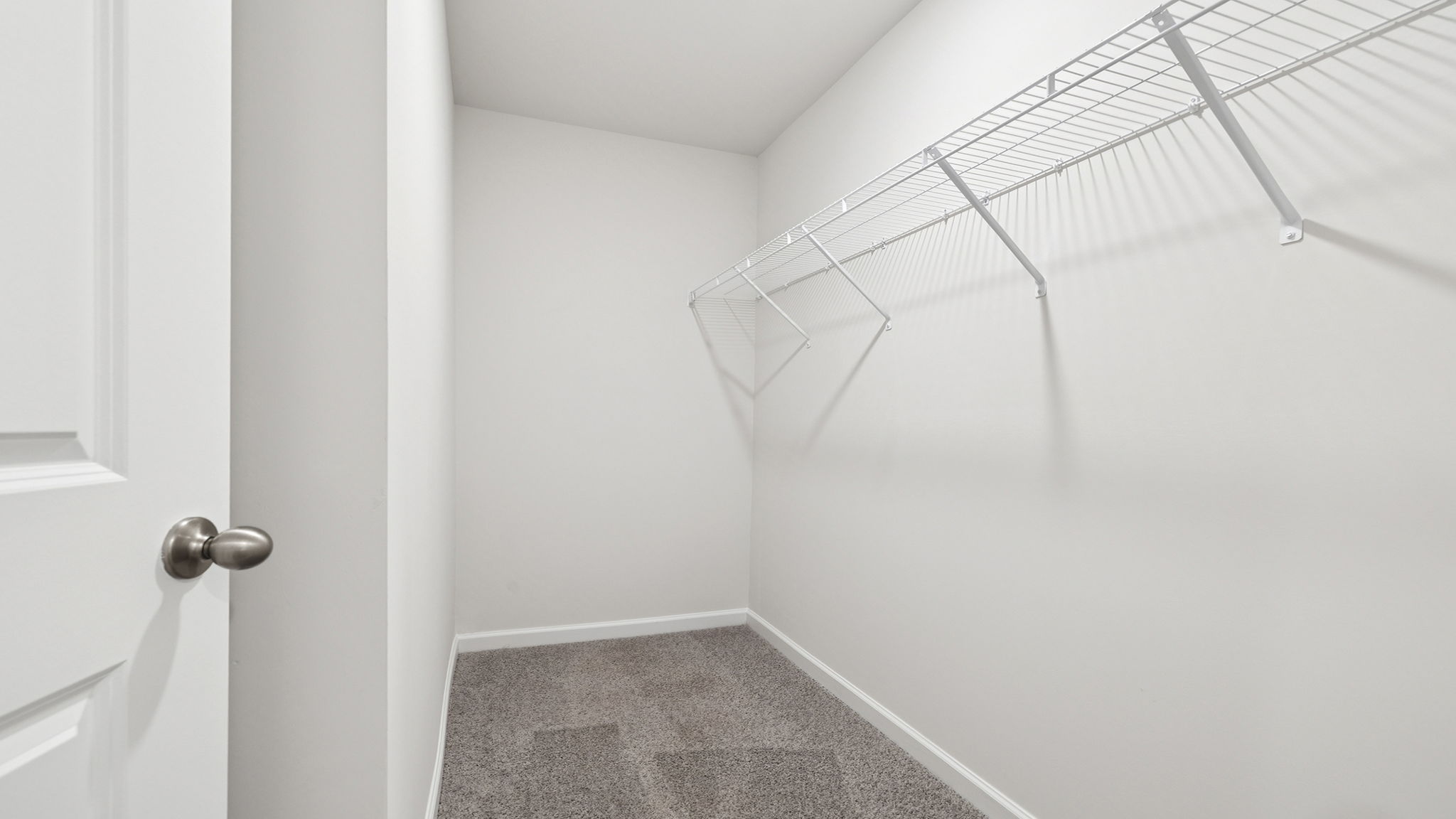 Primary bedroom walk-in closet.