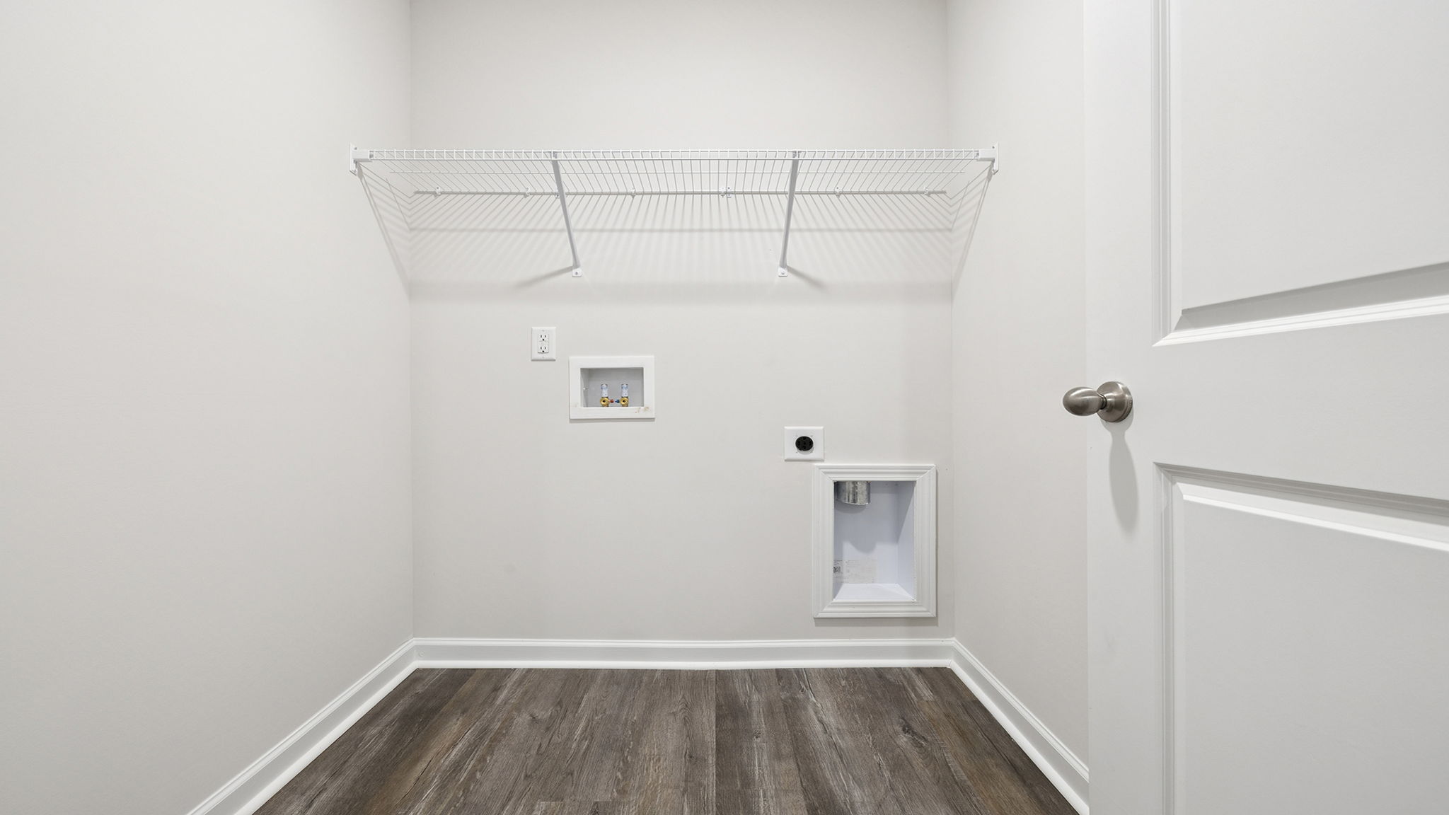 Laundry room with shelving.