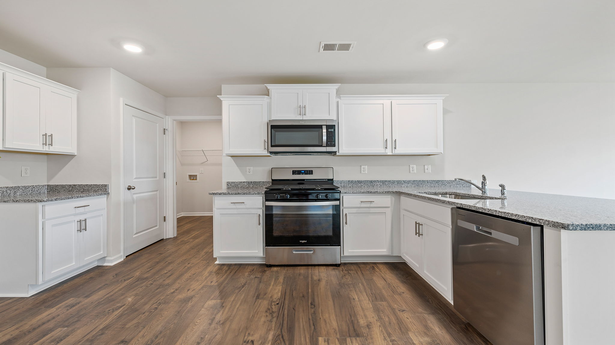 Kitchen with island and cabinets.