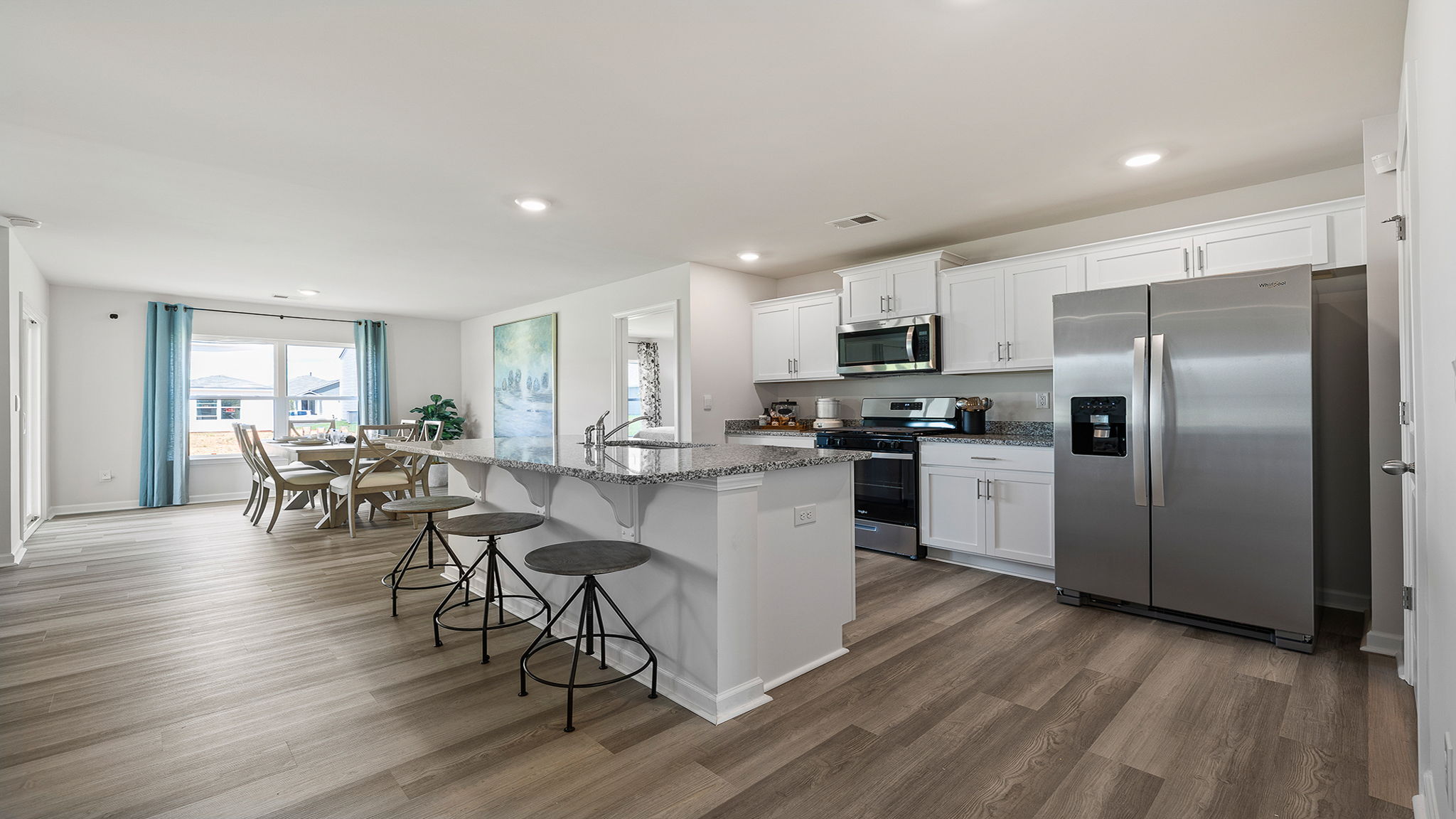 Kitchen with island and cabinets.