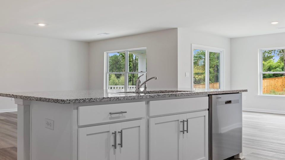 View from kitchen into dining and family rooms.