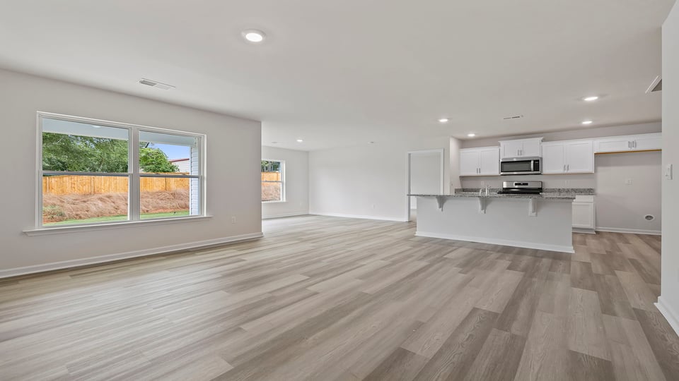 View from family room toward the open kitchen and dining area.