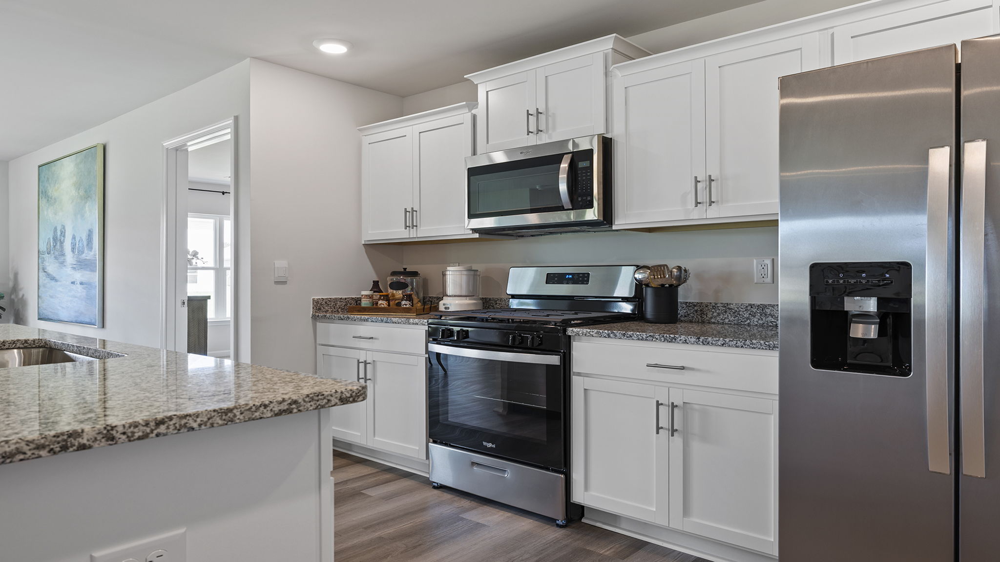 Kitchen with island and cabinets.