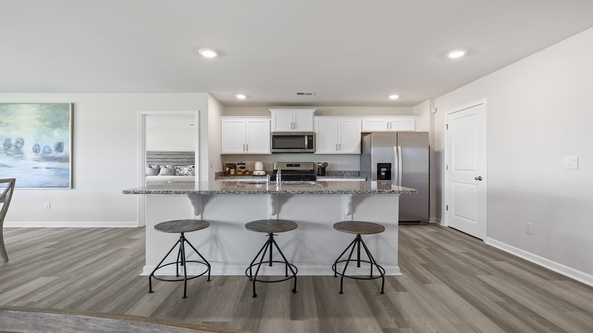 Kitchen with island and cabinets.