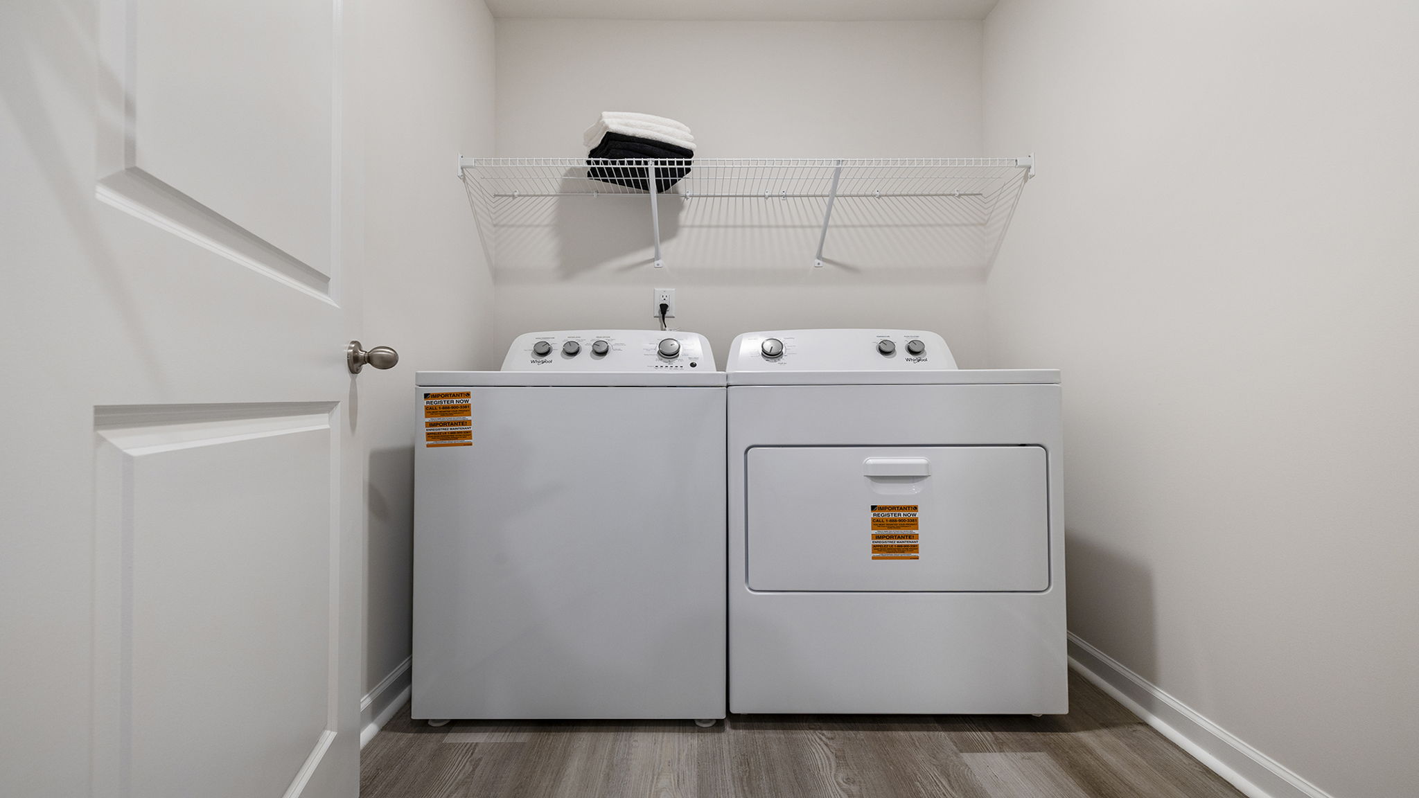 Laundry room with shelf.