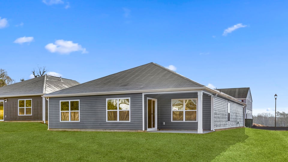 Back exterior with large backyard.