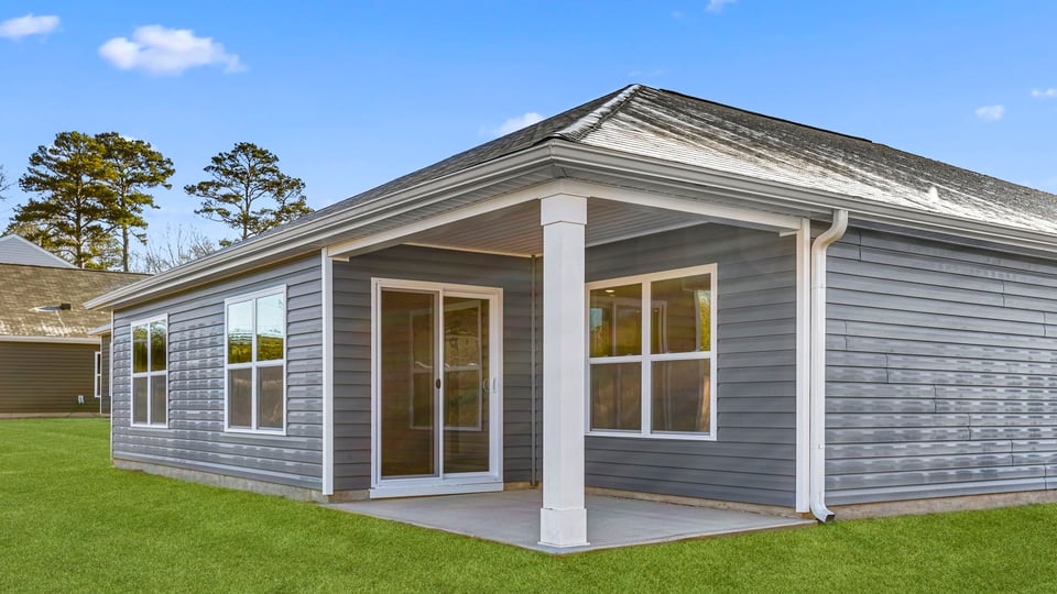 Back exterior with large backyard.