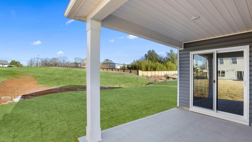 Back exterior with large backyard.