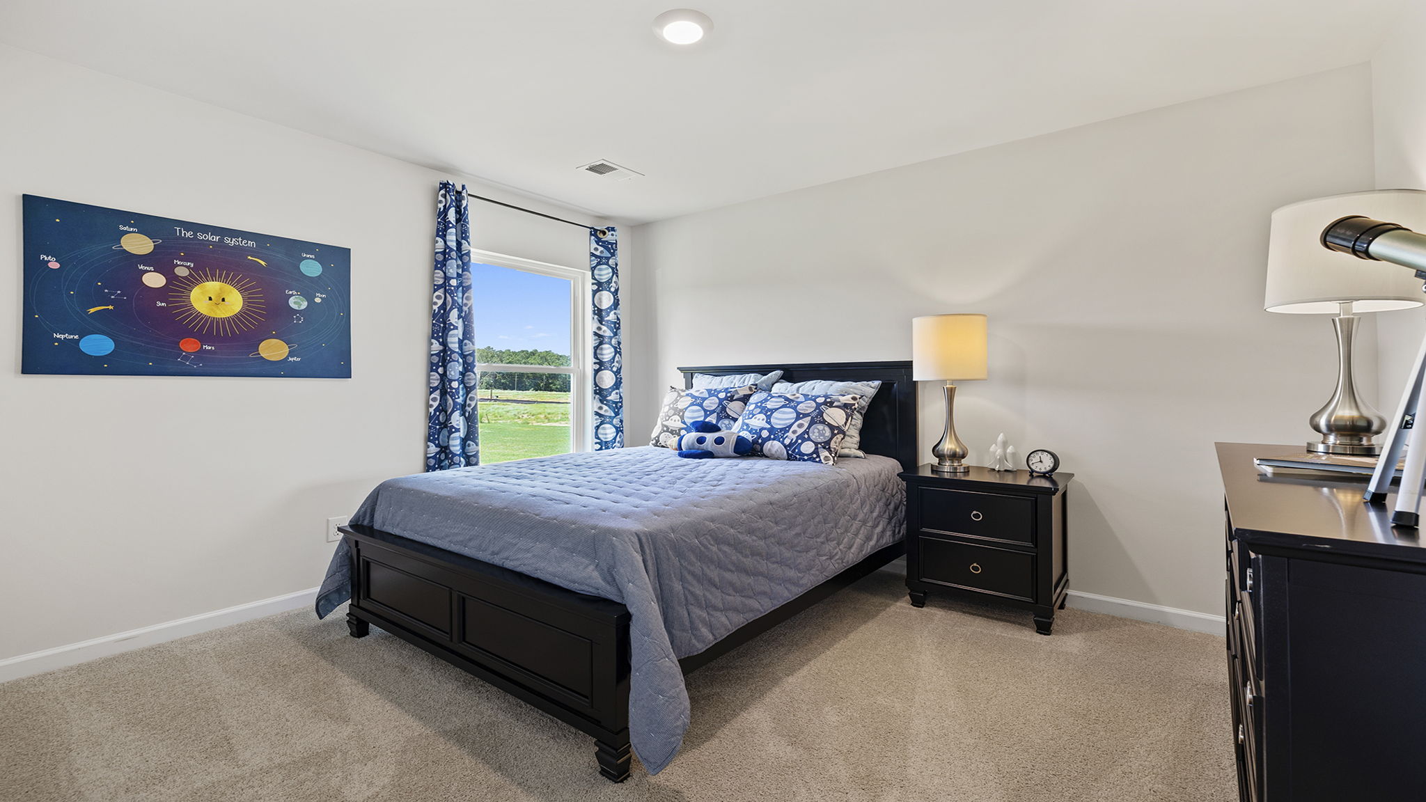 Bedroom with carpet and window.