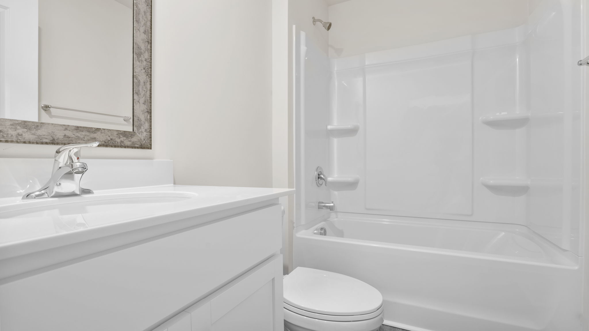 Hall bathroom with vanity and combination shower / tub.