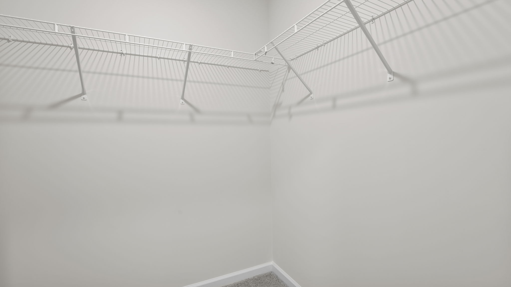 Primary bedroom walk in closet.