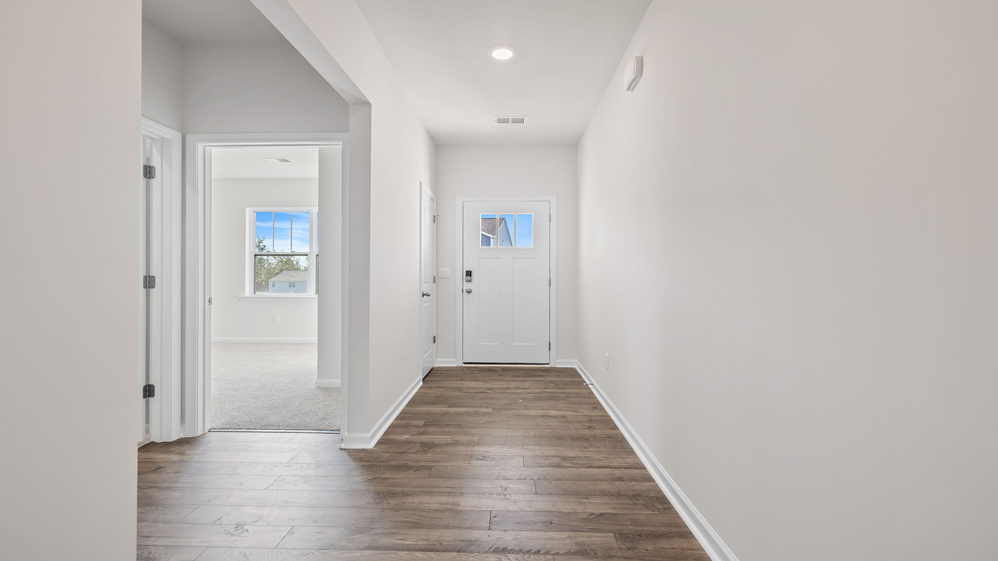 Bedroom with window and carpet.