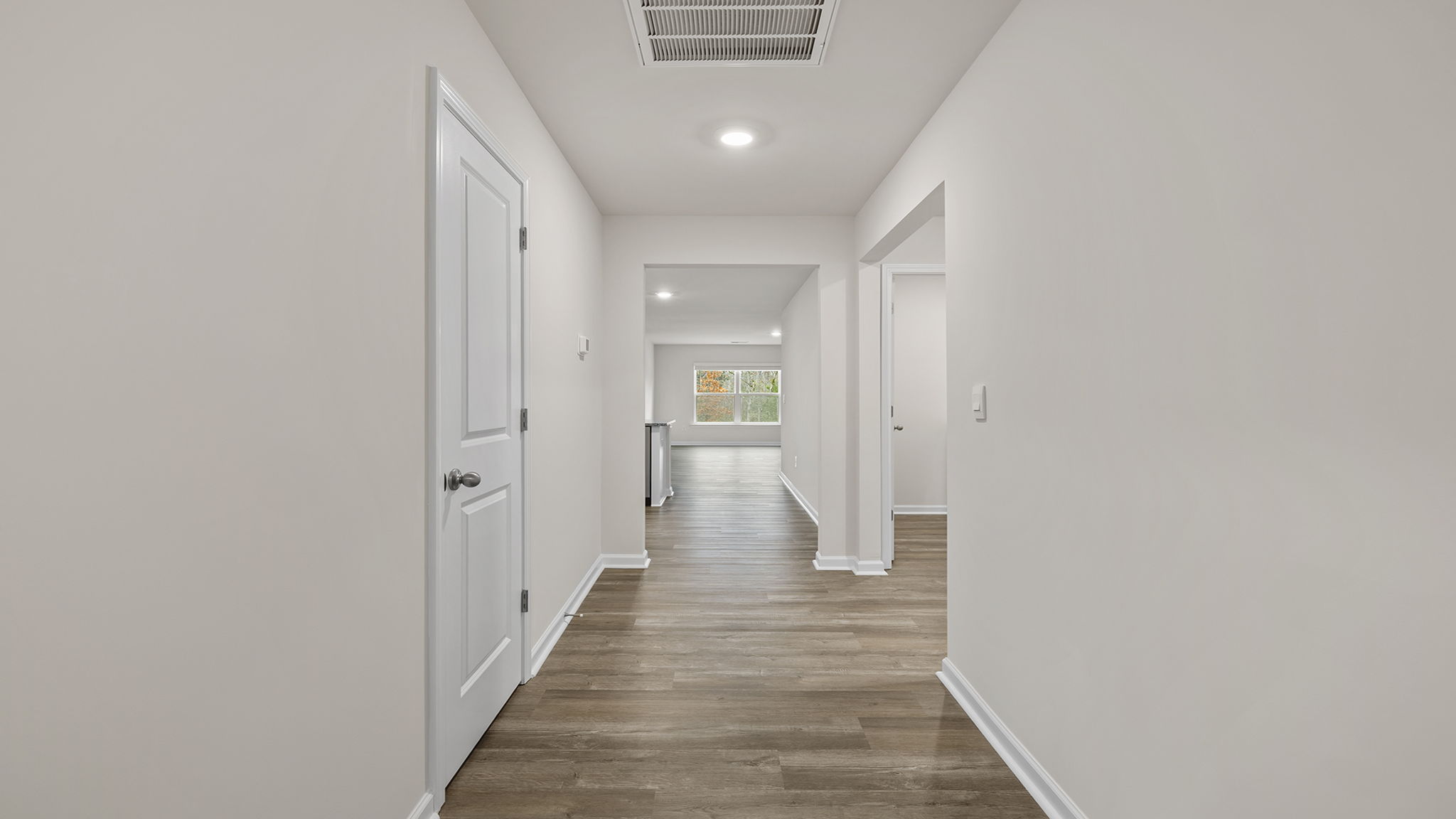 View of hallway and opening to 3rd bedroom.