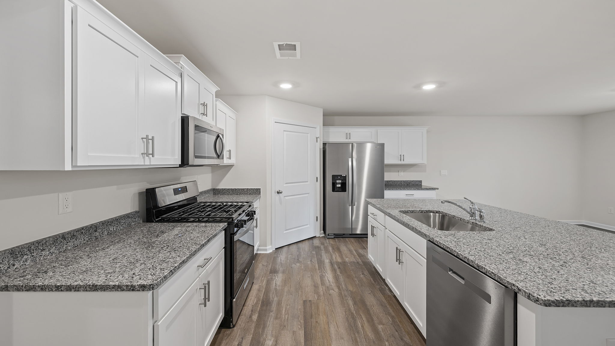 Kitchen has wonderful quartz countertops.