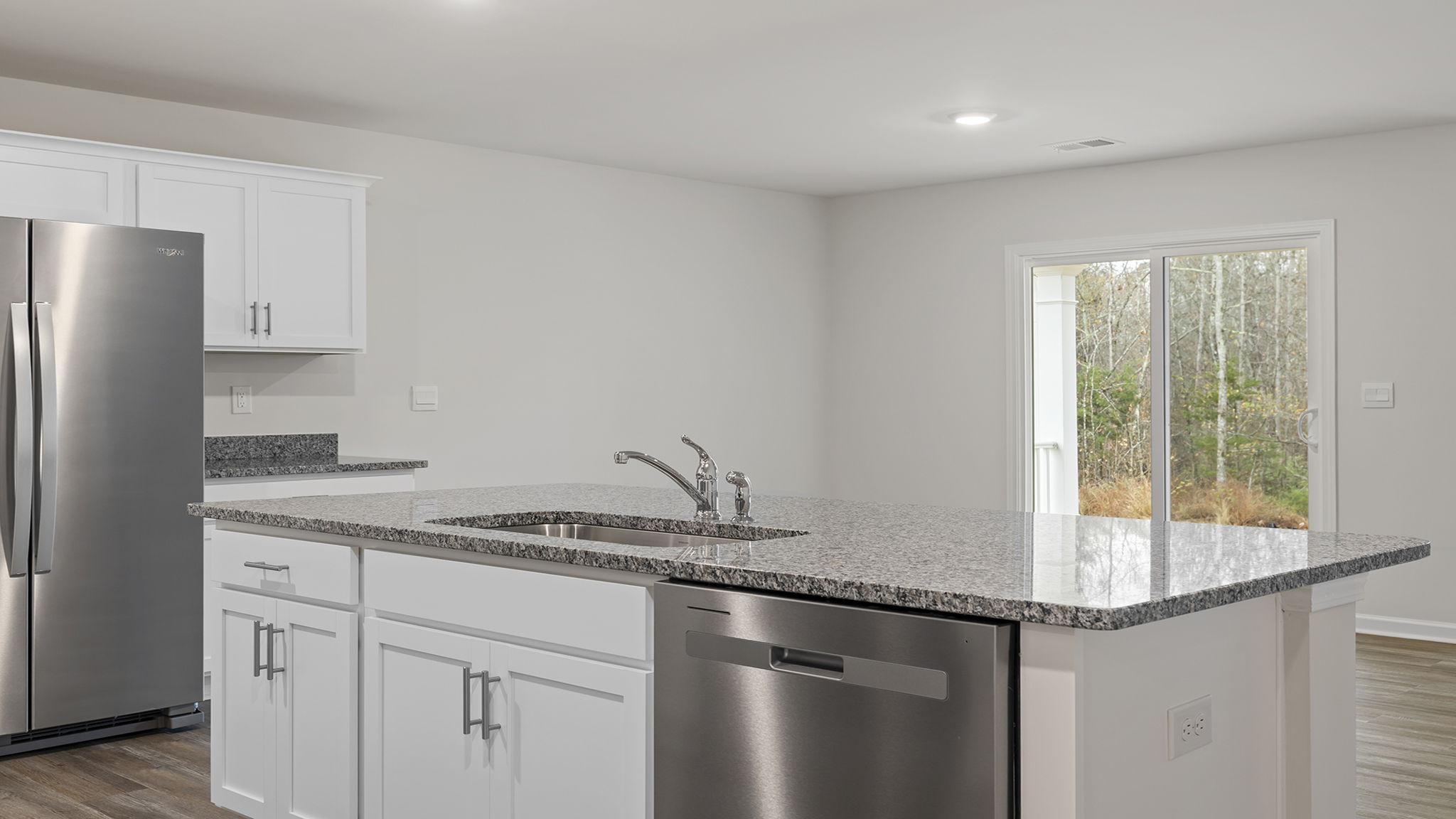 Island hosts sink and dishwasher.