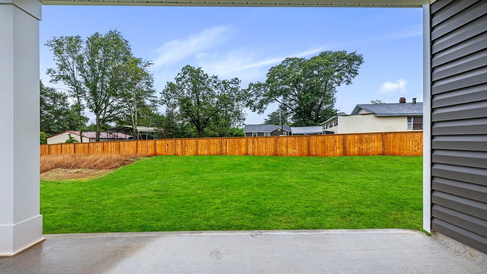 Back patio with large backyard.