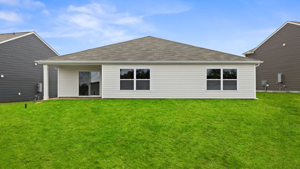 Back exterior with large backyard.
