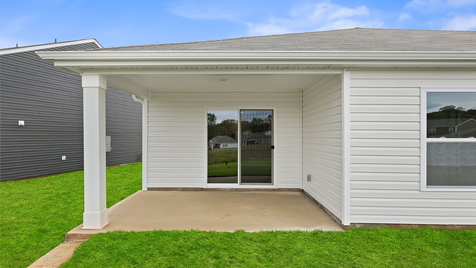 Back exterior with large backyard.
