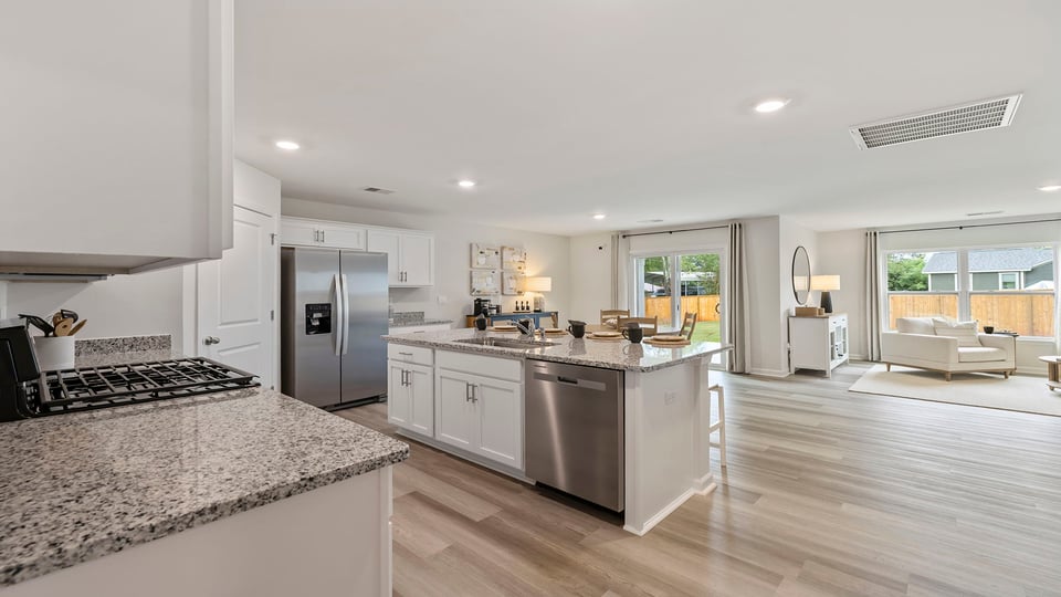 Kitchen with island and cabinets.