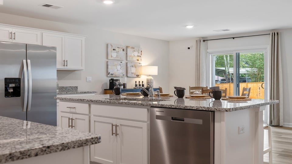 Kitchen with island and cabinets.
