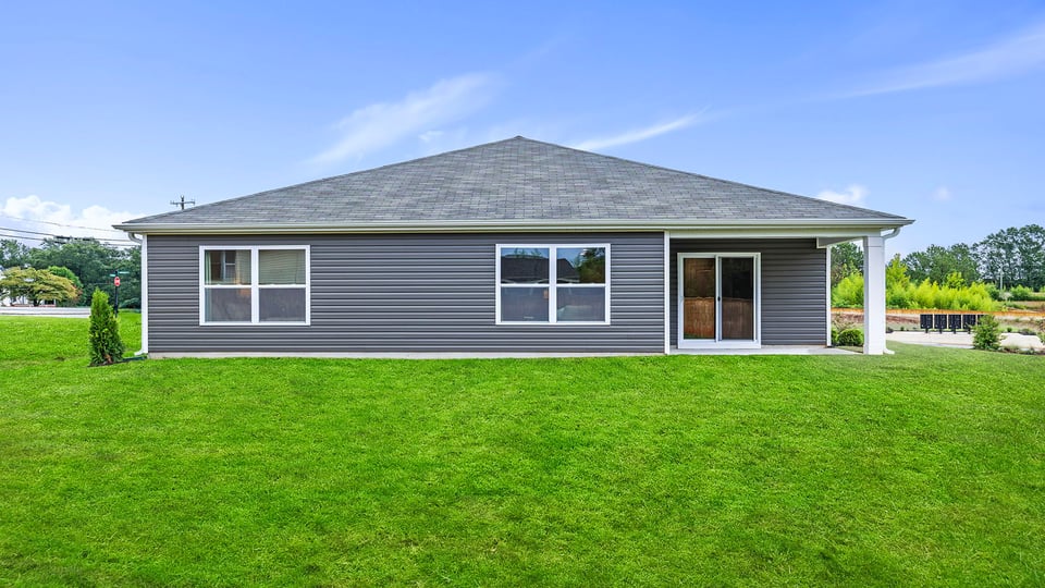 Back exterior with large backyard.