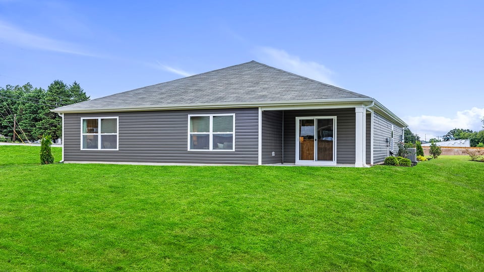 Back exterior with large backyard.