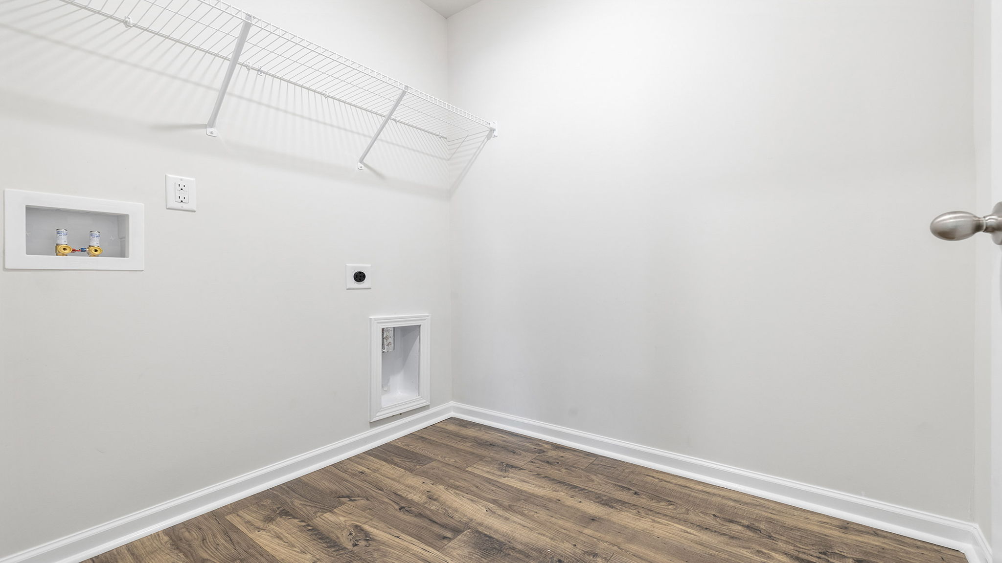 Laundry room with shelving.