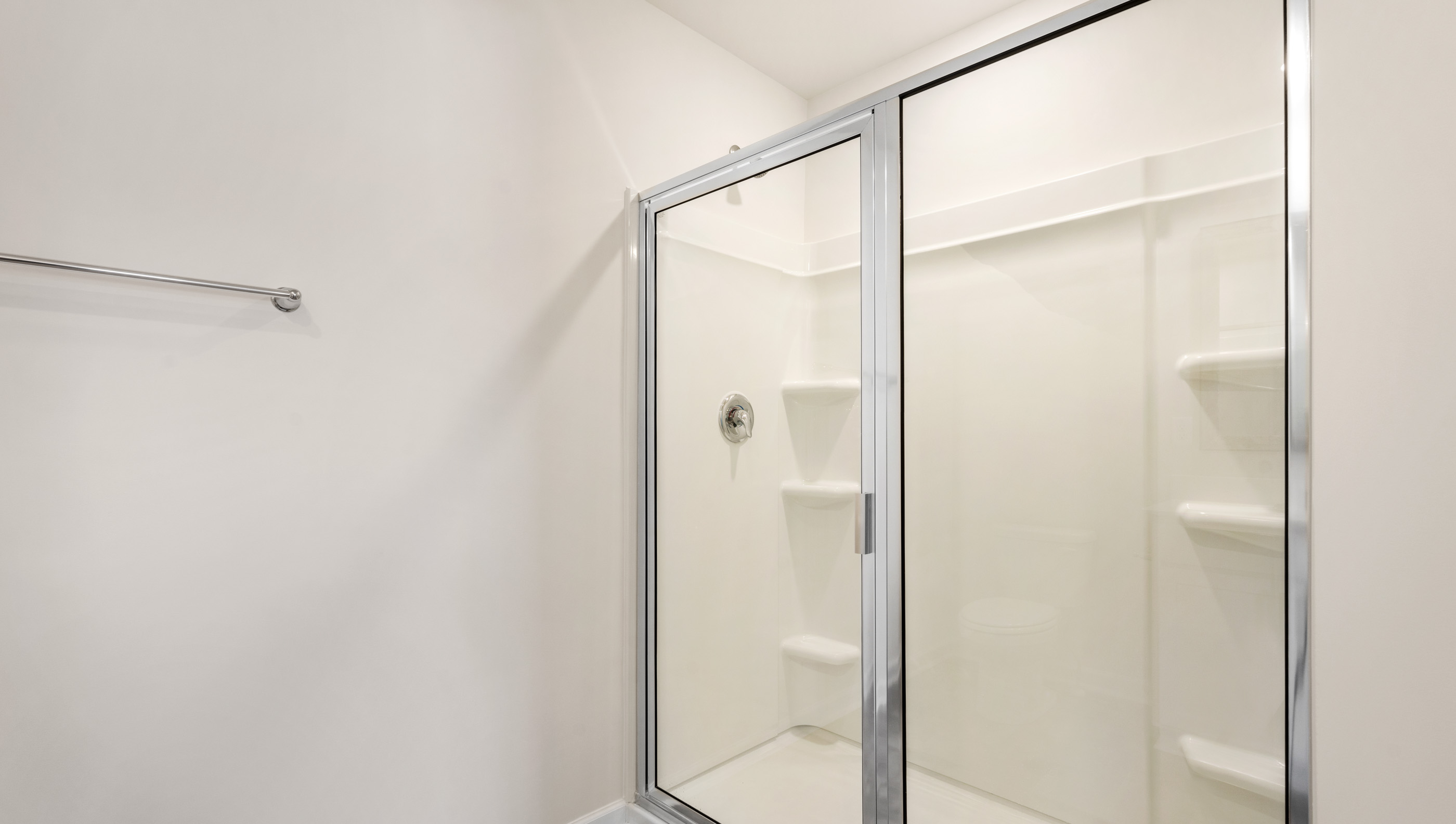 Bathroom with walk in shower.