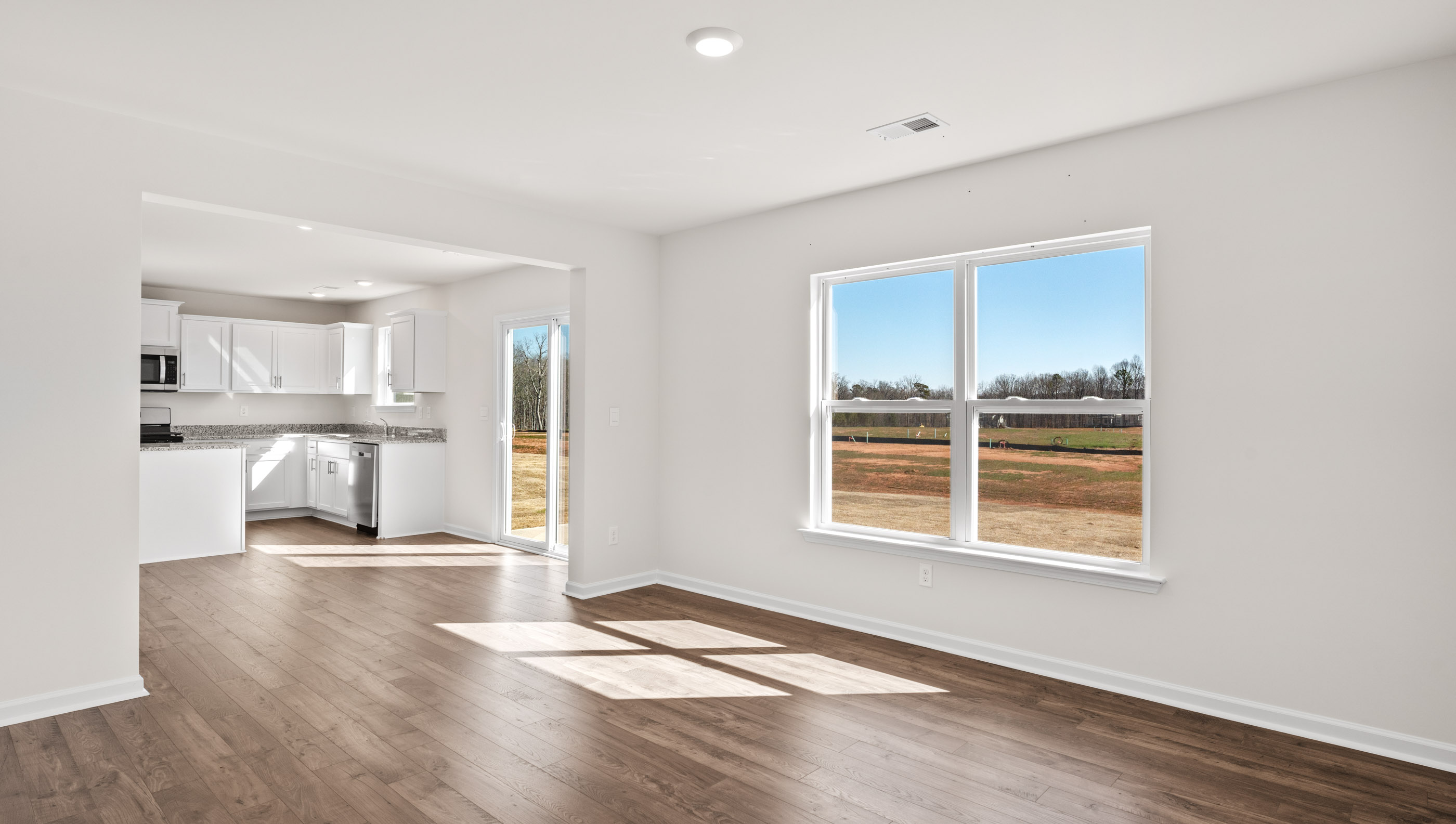 Family room with view of the kitchen.