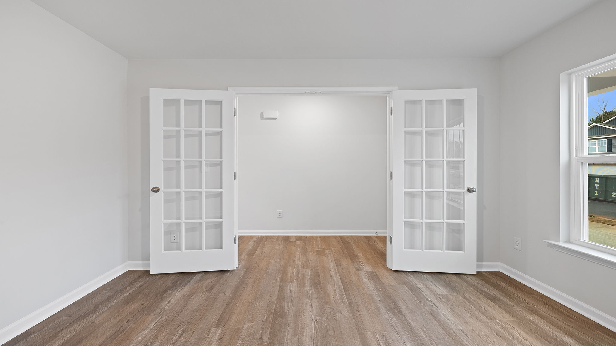 Study accented by French doors.