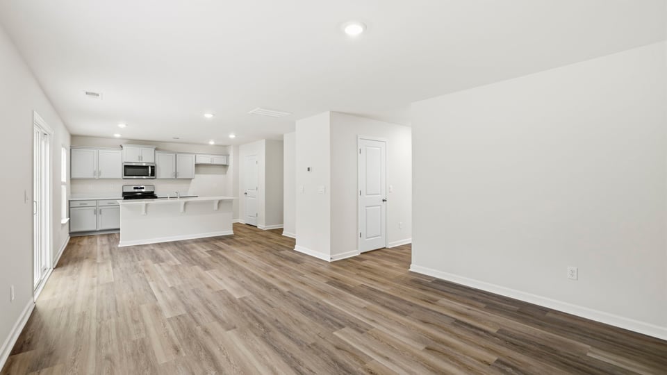 Family room with view of kitchen.