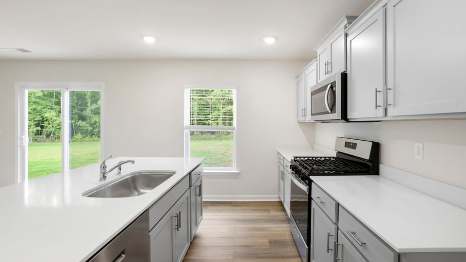 Kitchen with stainless steel appliances.