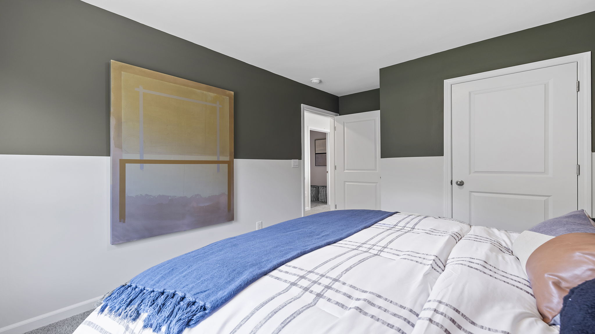 Bedroom with carpet and windows.