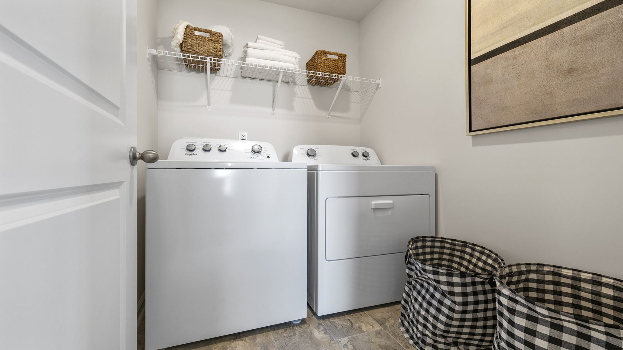 Laundry room with shelf.